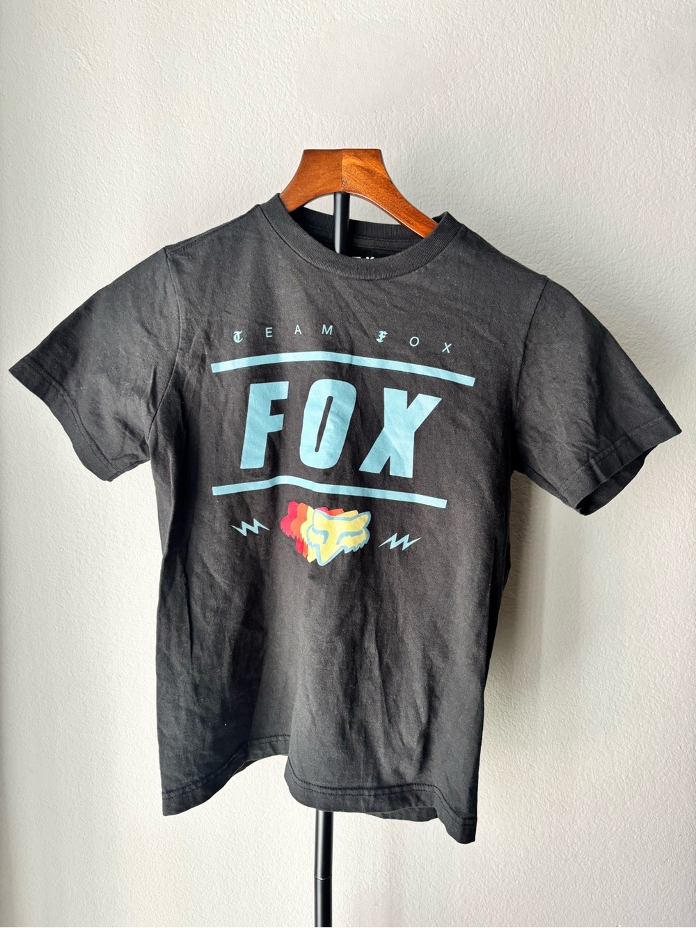 Fox Black Tee with Light Blue Logo and Multicolor Fox Emblem
